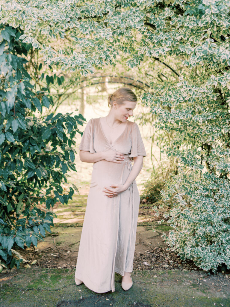 Mother anticipates growing her family during her professional maternity photo shoot.