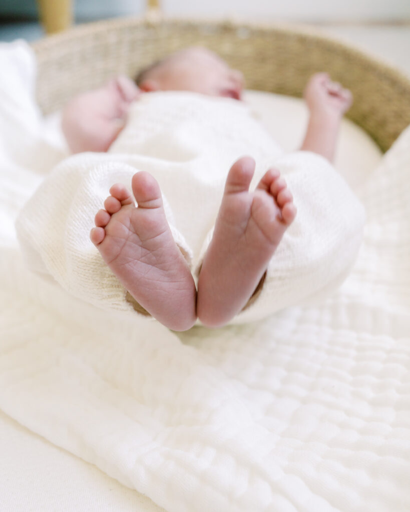 Detail photo of newborn baby's feet making the shape of a heart by Lawton Newborn Photographer Courtney Cronin